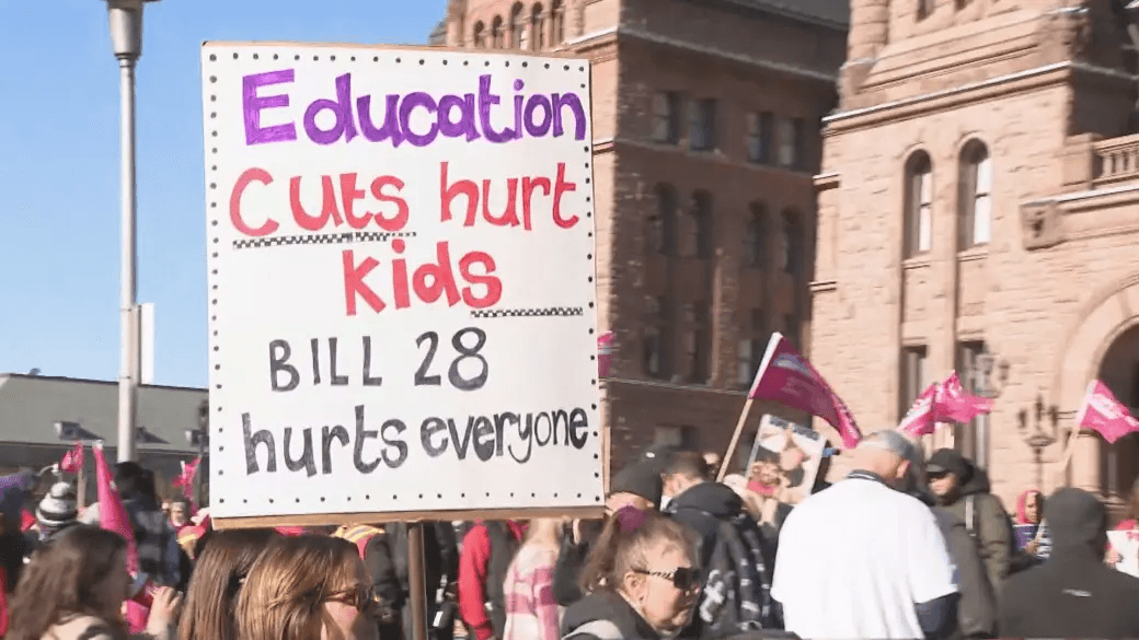 Protestors ralling to protest against Bill 28